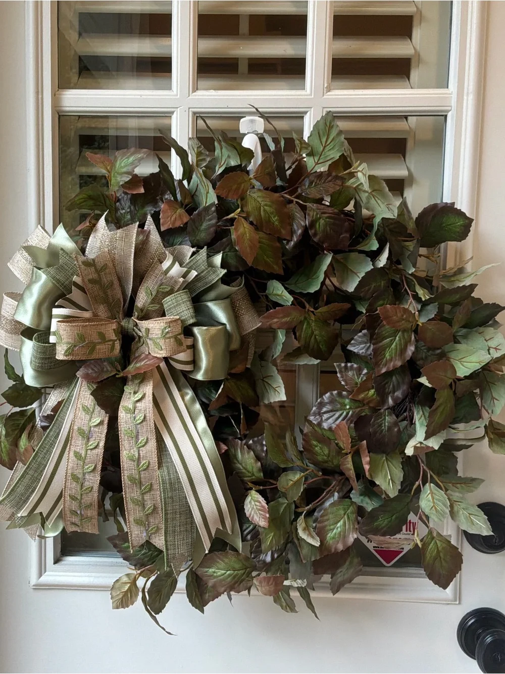 Green Leaf Holiday Wreath with Decorative Striped Ribbon Bow